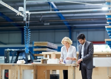 Two Coworkers in Factory