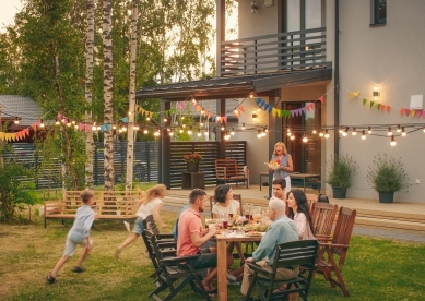 Family gathering outside for meal