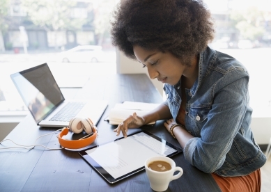 Woman on tablet in coffee shop