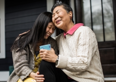 Mother and Adult Daughter Sitting on Porch