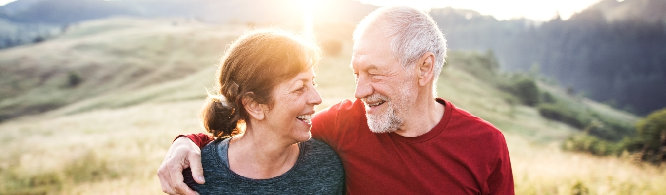 Couple walking in field