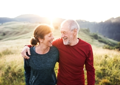 Couple walking in field