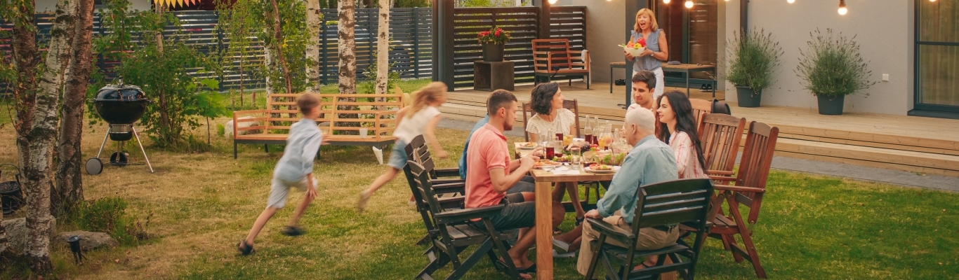 Family gathering outside for meal